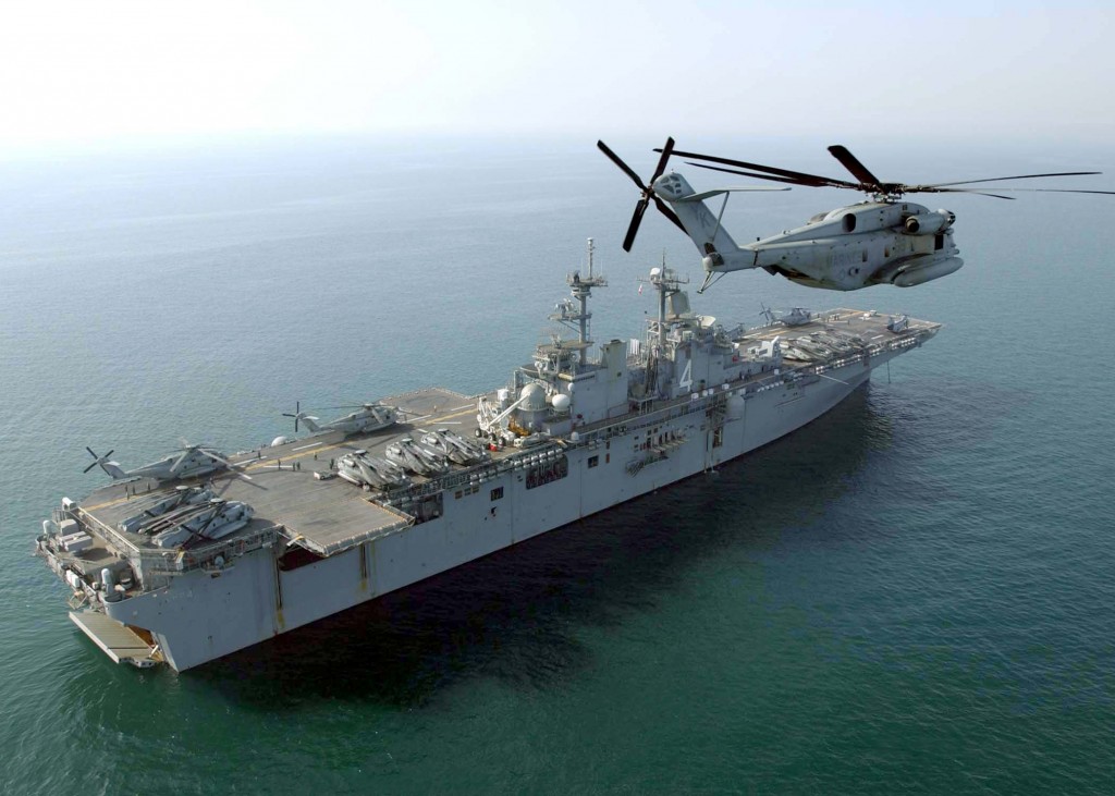 US_Navy_040219-N-7912E-005_An_U.S._Marine_Corps_CH-53E_Super_Stallion_flies_past_the_amphibious_assault_ship_USS_Boxer_(LHD_4)