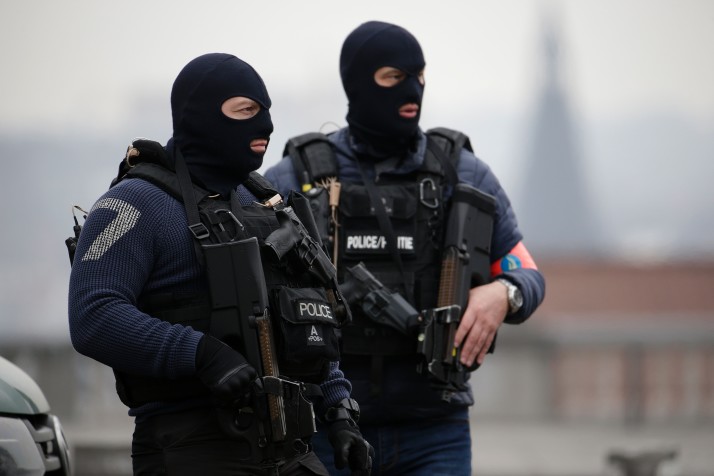 Special police forces stand guard outside the Council Chamber of Brussels on March 24, 2016 during investigations into the Paris and Brussels terror attacks. More than 30 people have been identified as being involved in a network behind the Paris attacks on November 13, with links now established to this week's bombings in Brussels. AFP PHOTO / KENZO TRIBOUILLARD / AFP / KENZO TRIBOUILLARD (Photo credit should read KENZO TRIBOUILLARD/AFP/Getty Images)