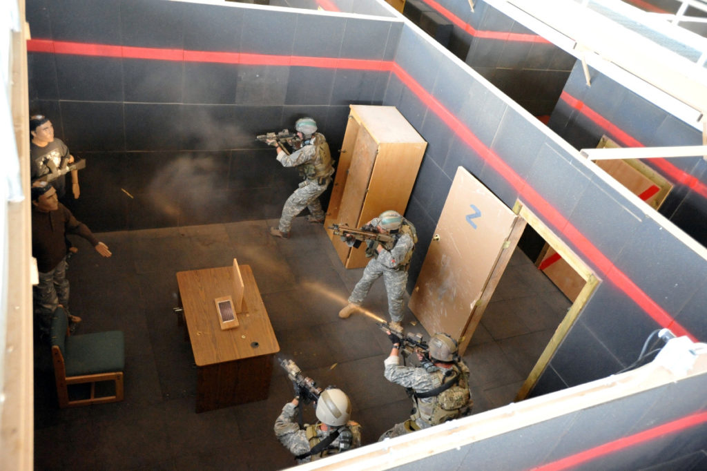 Special Forces Soldiers from 3rd Battalion, 10th SF Group (Airborne), conduct shoot-house operations during a culmination exercise at Fort Carson, Colo., Sept. 30. (Photo by Sgt. Steven L. Phillips)