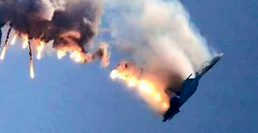 An image grab made from a video shows a burning Russian fighter jet coming down after being shot down near the Turkish-Syrian border, in Hatay on November 24, 2015. NATO member Turkey shot down a Russian fighter jet on the Syrian border today, threatening a major spike in tensions between two key protagonists in the four-year Syria civil war. AFP PHOTO / IHLAS NEWS AGENCY ***TURKEY OUT*** / AFP / IHLAS NEWS AGENCY / - (Photo credit should read -/AFP/Getty Images)
