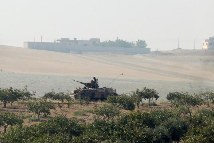 A Turkish army armoured vehicle is pictured in Karkamis on the Turkish-Syrian border in the southeastern Gaziantep province, Turkey. REUTERS/Stringer