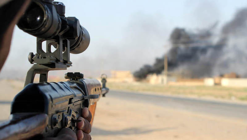 A member of the Iraqi Shiite militia, Kataib Hezbollah (Hezbollah Brigades), aims his rifle during fighting against Islamic State (IS) fighters, in Amerli town, northeastern Baghdad, Iraq, 01 September 2014. EPA/STR