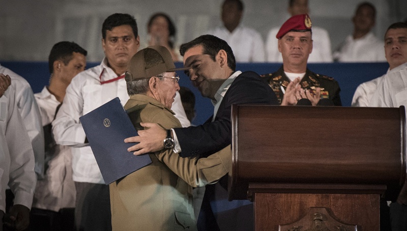 epa05653275 A handout picture shows Greek Prime Minister Alexis Tsipras (R) greeting Cuban President Raul Castro (L) during the farewell ceremony for the late Cuban former President Fidel Castro at the Plaza de la Revolution of Havana, Cuba, 29 November 2016. Cubans are gathering at the Jose Marti Monument in Havana's Plaza of the Revolution to bid farewell to Cuban former President Fidel Castro. Castro died at the age of 90 on 25 November. EPA/ANDREA BONETTI / GREEK PRIME MINISTER'S PRESS OFFICE / HANDOUT HANDOUT EDITORIAL USE ONLY/NO SALES