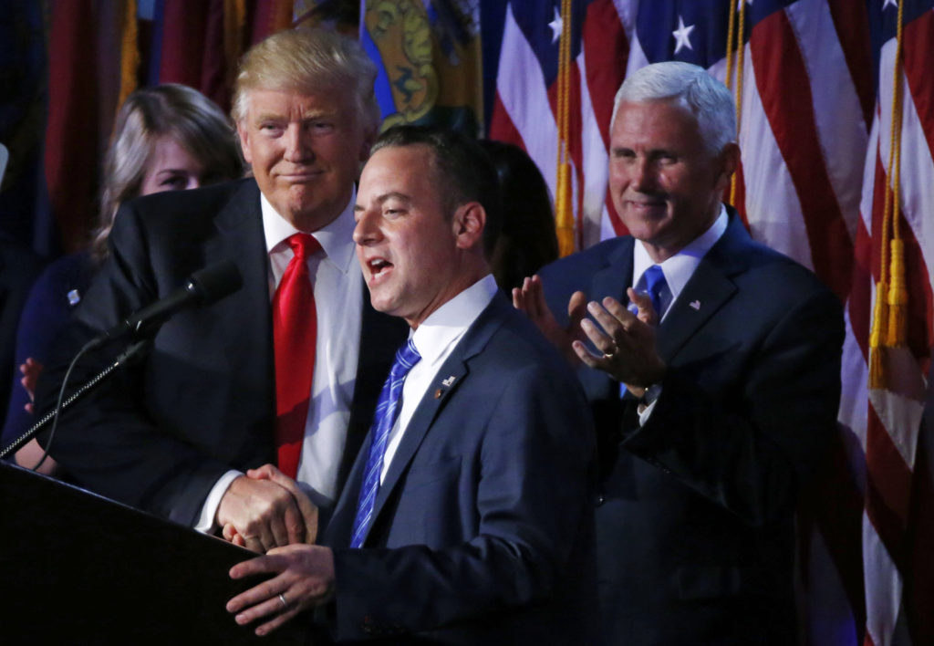 U.S. President elect Donald Trump shakes hands with Republican National Committee Chairman Reince Priebus (C) as Vice President-elect Mike Pence (R) looks onat election night rally in Manhattan, New York, U.S., November 9, 2016. REUTERS/Jonathan Ernst