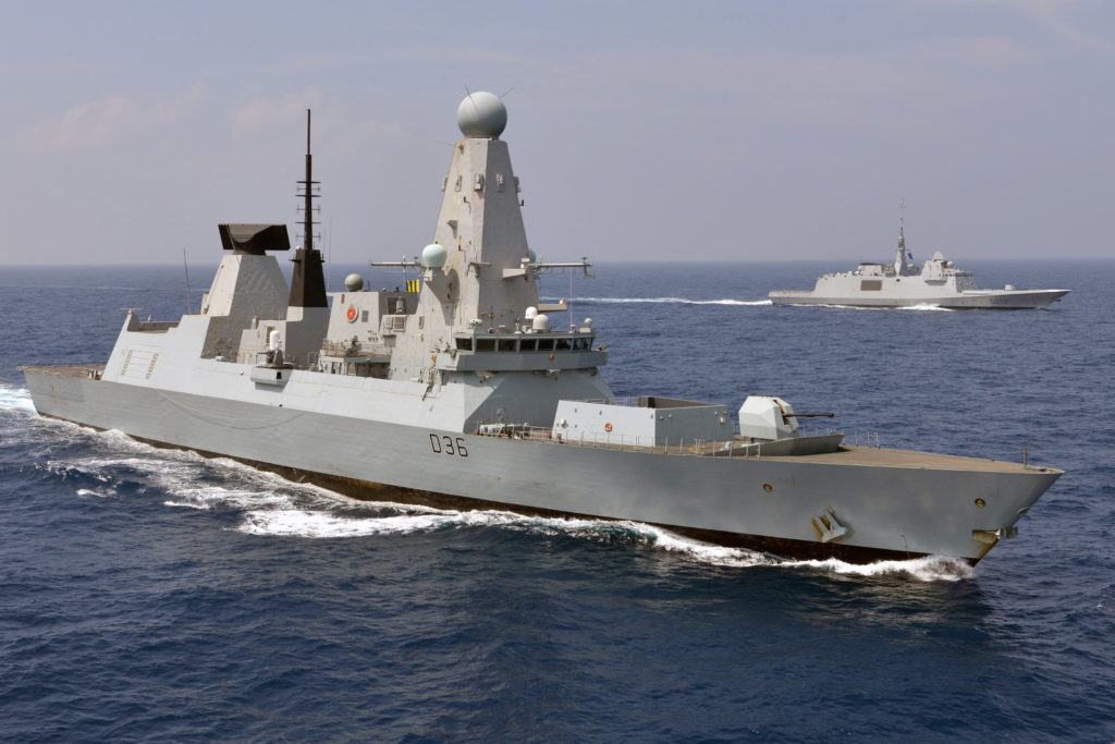 Pictured is HMS DEFENDER conducting joint military training in the Indian Ocean with the French ship FS PROVENCE (D652). The Type 45 destroyer, also known as the D or Daring class, is an advanced class of guided missile destroyers built for the Royal Navy. Destroyers are part of the backbone of the Royal Navy, committed around the world 365 days a year hunting pirates, drug runners or submarines, defending the Fleet from air attack, and providing humanitarian aid after natural disasters. Britain's 6 Type 45 destroyers are the most advanced warships the nation has ever built. Their mission is to shield the Fleet from air attack using Sea Viper missile which can knock targets out of the sky up to 70 miles away. FS PROVENCE (D652) Third FREMM (Aquitaine class) built for the French navy, but the second in service in the fleet since the No. 2 (Normandy) was sold to Egypt.